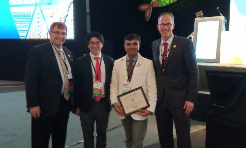 reciveing from Volker Musahl & Jason Koh, Chair ,ISAKOS scientific committee USA,Prestigious ISAKOS Young Investiageor Award at Cancun, 2019 , Mexico, North America